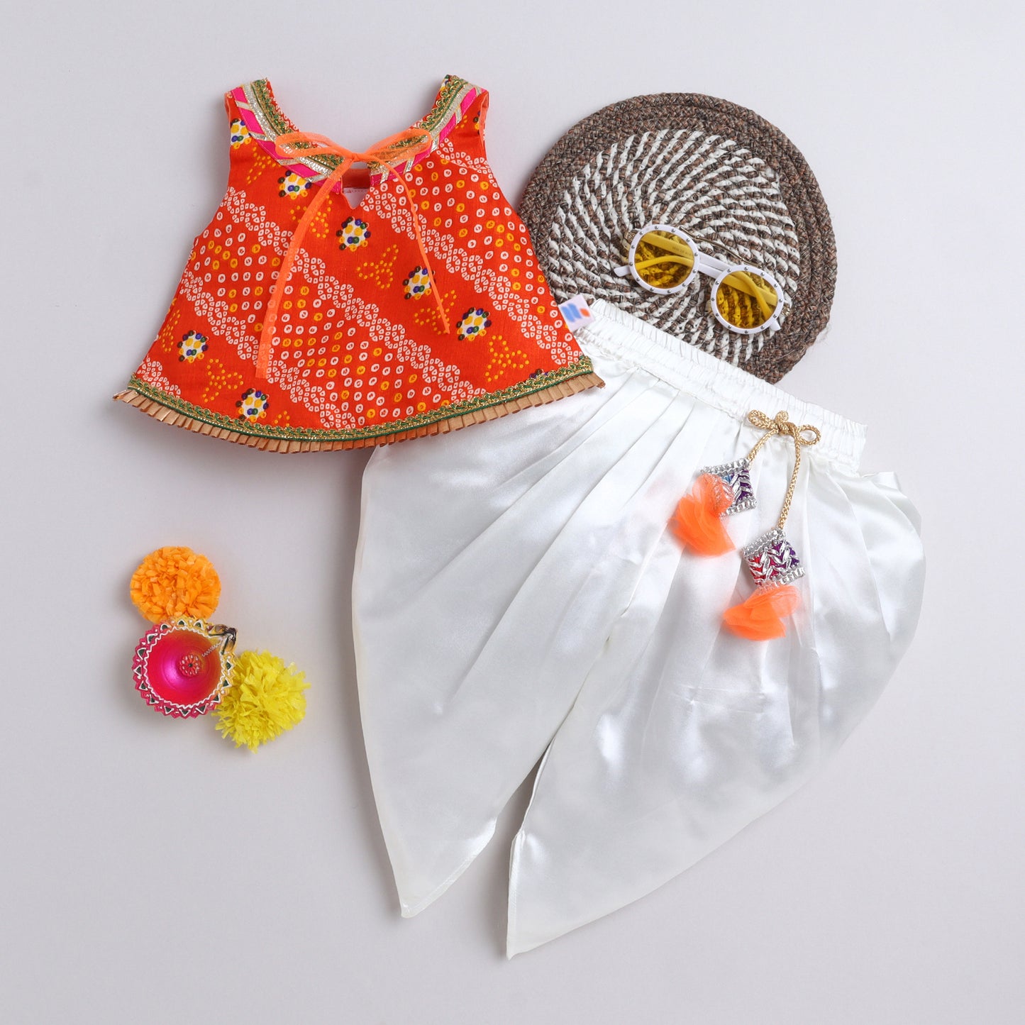 Many Frocks & satin sleeveless bandhani lace and latkan embellished dhoti top set- orange and cream