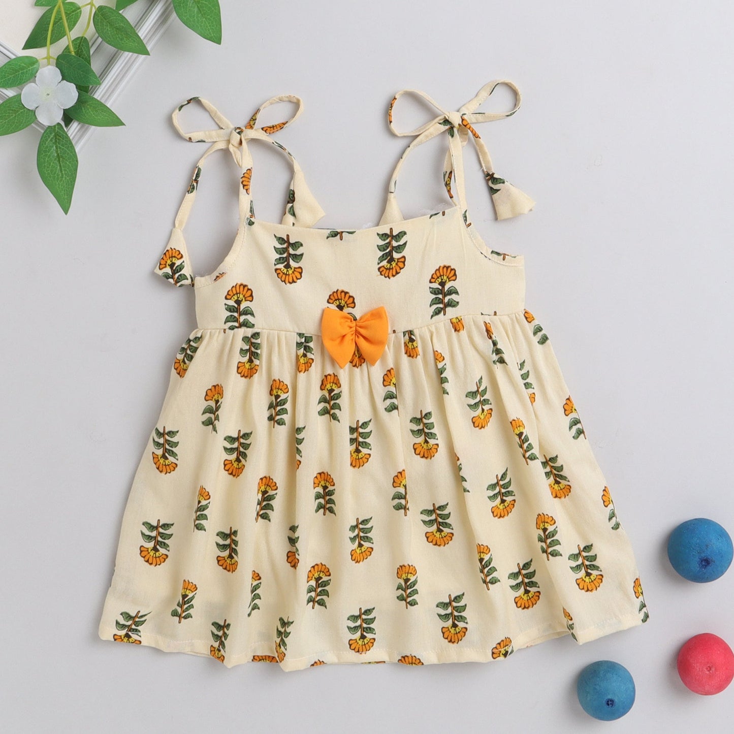 Many Frocks knee length foral printed silky textured baby dress - Yellow & Cream