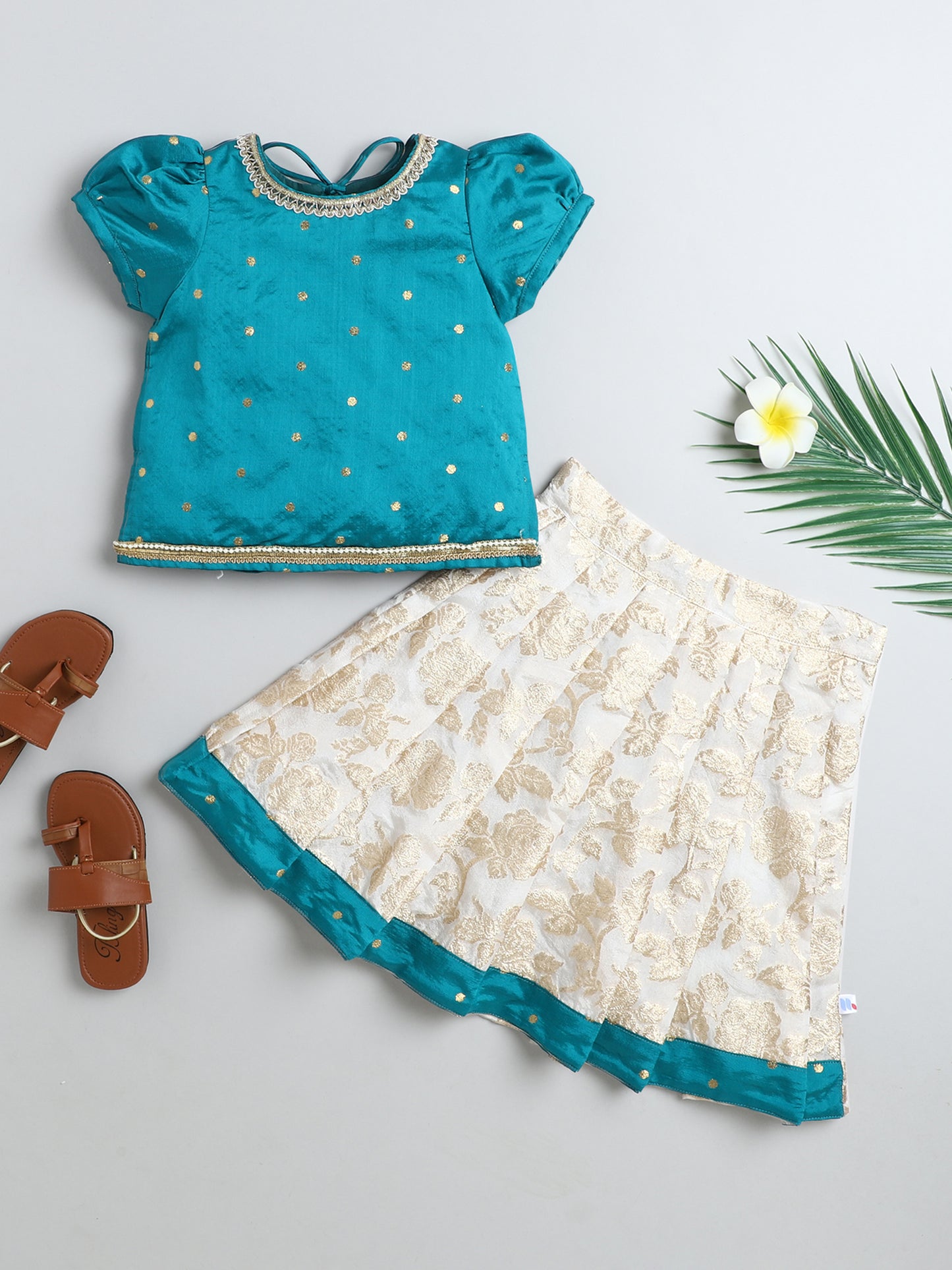 Many Frocks & Poly Slik & Banarasi woven Puff  Sleeves Lace Embellished Full Length Flared Girls Choli And Lehenga Pattu Pavdai Set  - Cream & Green